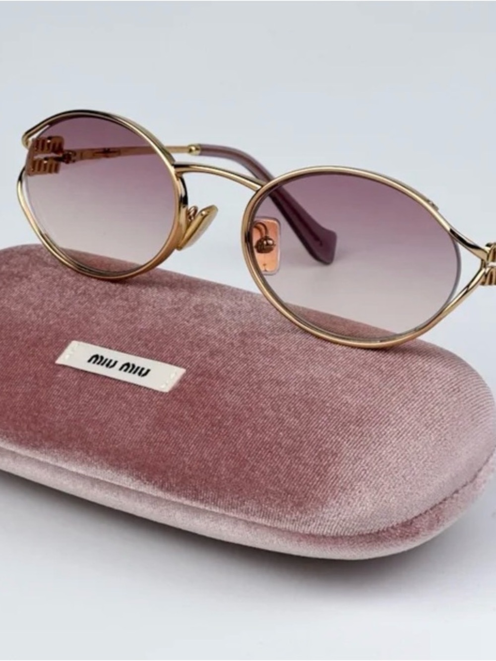 Miu Miu Gold Frame Sunglasses with Purple Gradient Lenses